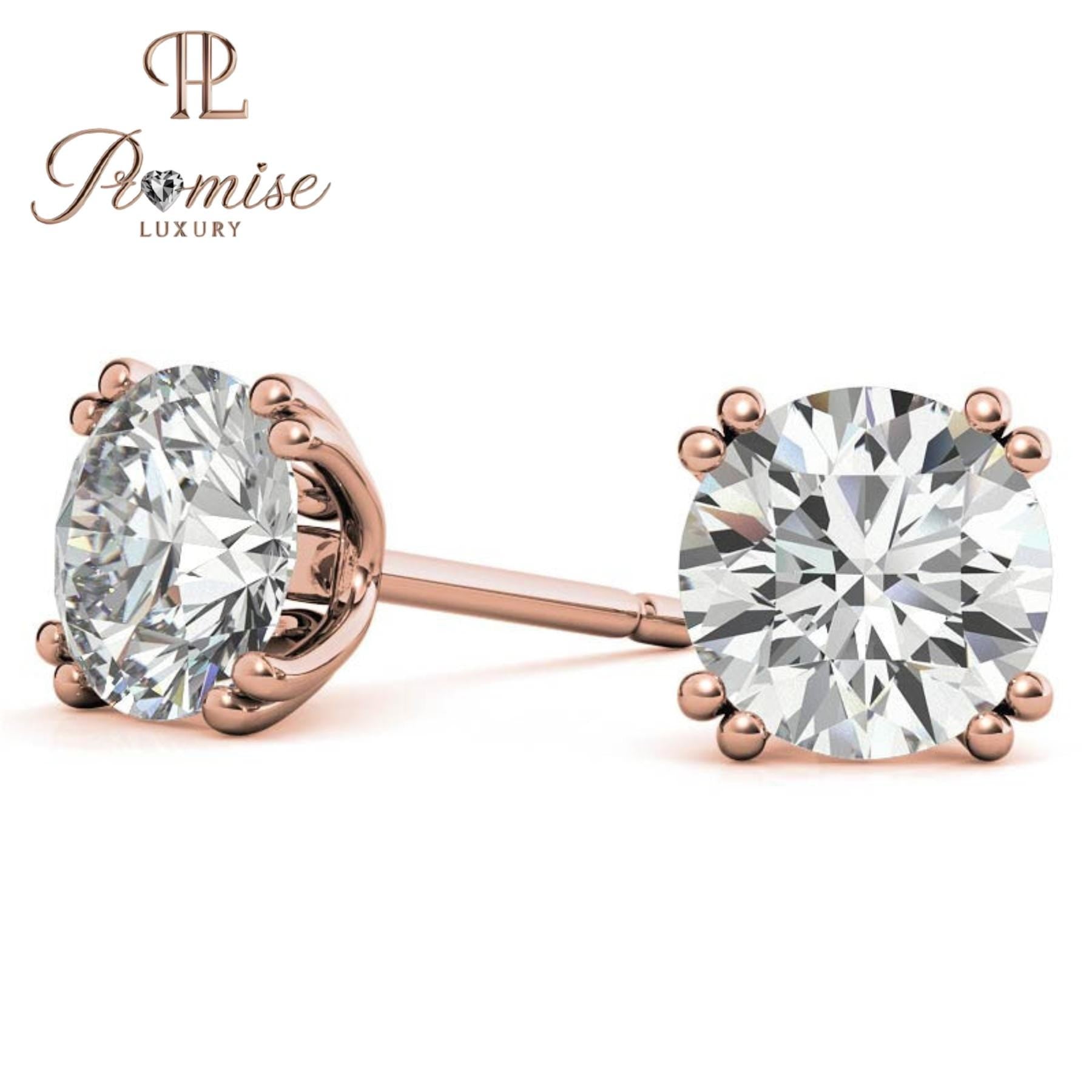 Stunning diamond floral stud earrings in 18K gold featuring a radiant center with a sparkling halo of brilliant round diamonds