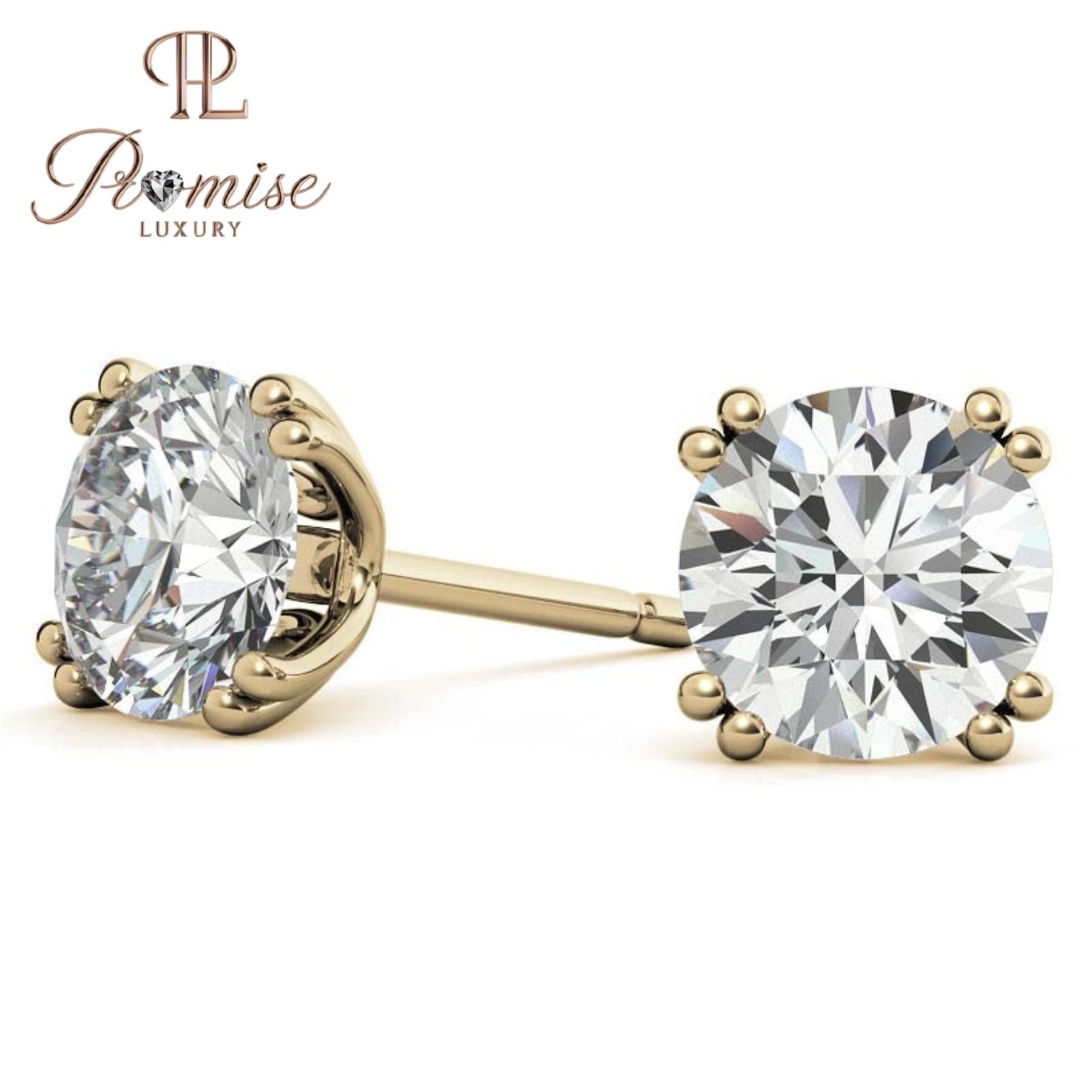 Stunning diamond floral stud earrings in 18K gold featuring a radiant center with a sparkling halo of brilliant round diamonds