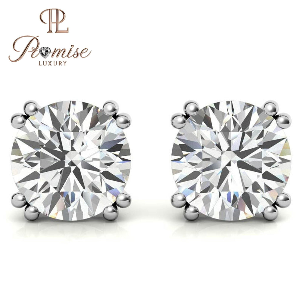 Stunning diamond floral stud earrings in 18K gold featuring a radiant center with a sparkling halo of brilliant round diamonds