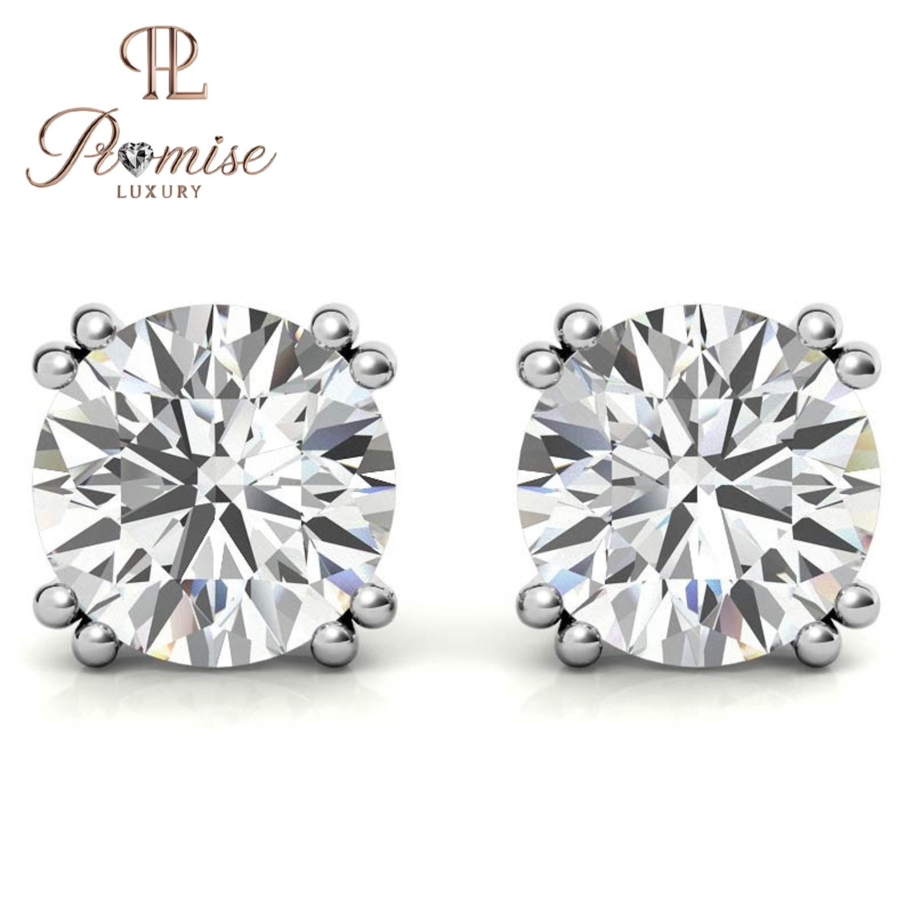 Stunning diamond floral stud earrings in 18K gold featuring a radiant center with a sparkling halo of brilliant round diamonds